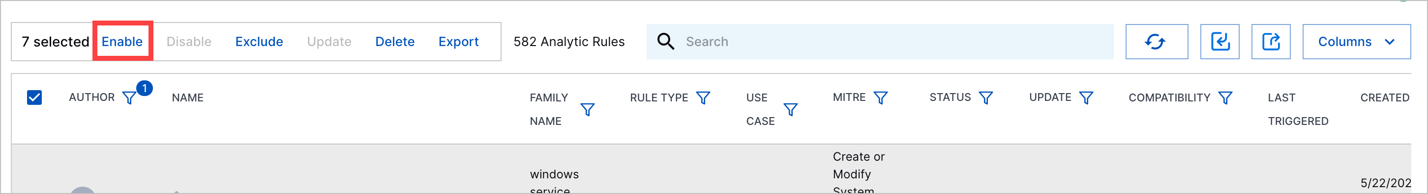 The enable action when you select multiple analytics rules highlighted in a red rectangle.